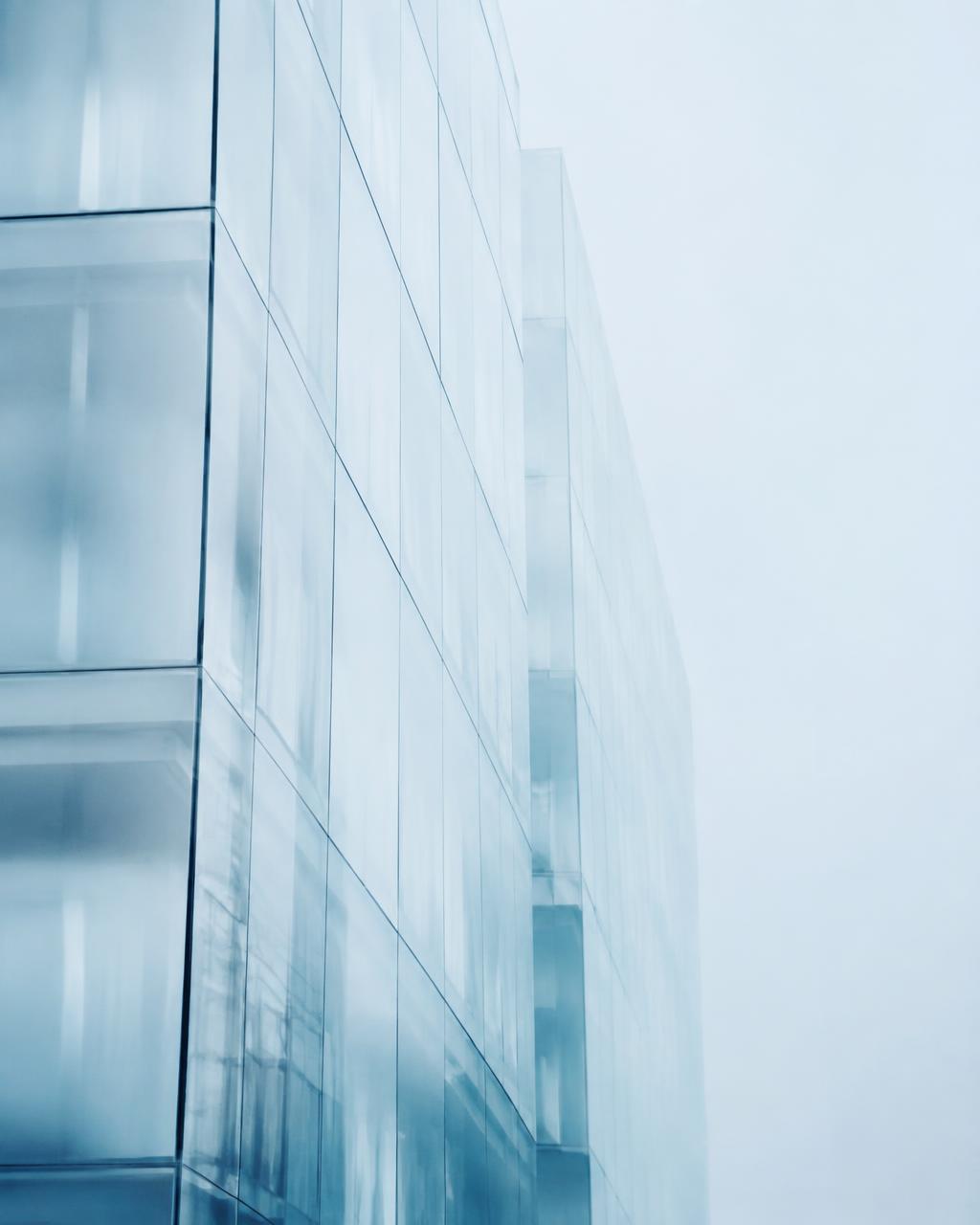 Frosty glass skyscraper facade in pale Scandinavian light